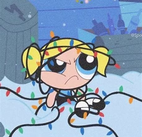 the powerpuff character is sitting on top of a pile of christmas lights