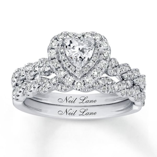 a heart shaped diamond engagement ring with the words neil lane next love written on it