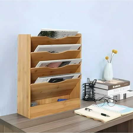 a wooden desk with a magazine rack on it and some books in front of it