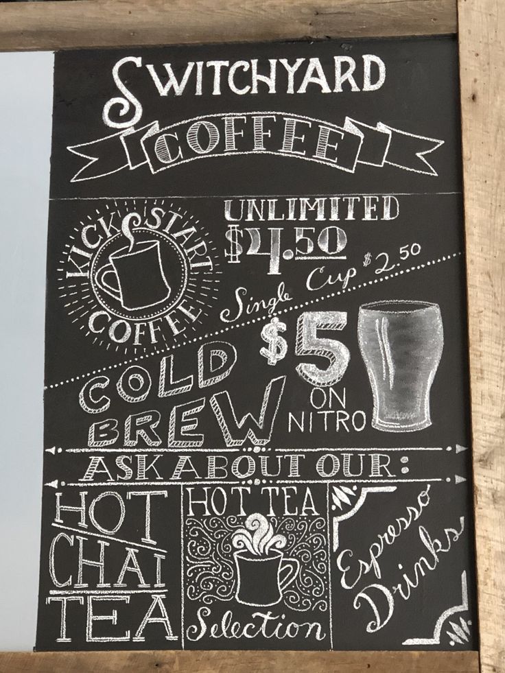 a chalkboard sign with different types of drinks and prices on it's side