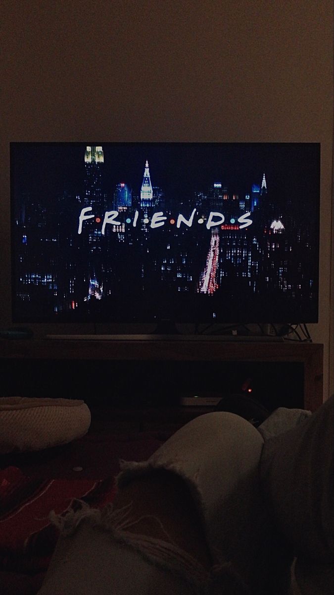 someone is watching friends on tv in their living room