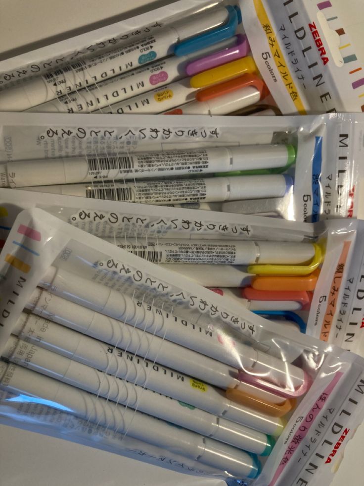 several different types of pens in plastic bags