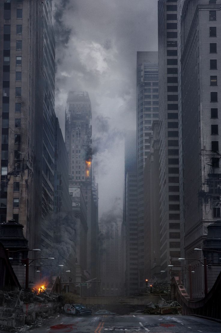 a city street with tall buildings on both sides and dark clouds in the sky above