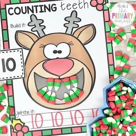 a christmas themed counting game with candy in front of it and an image of a reindeer