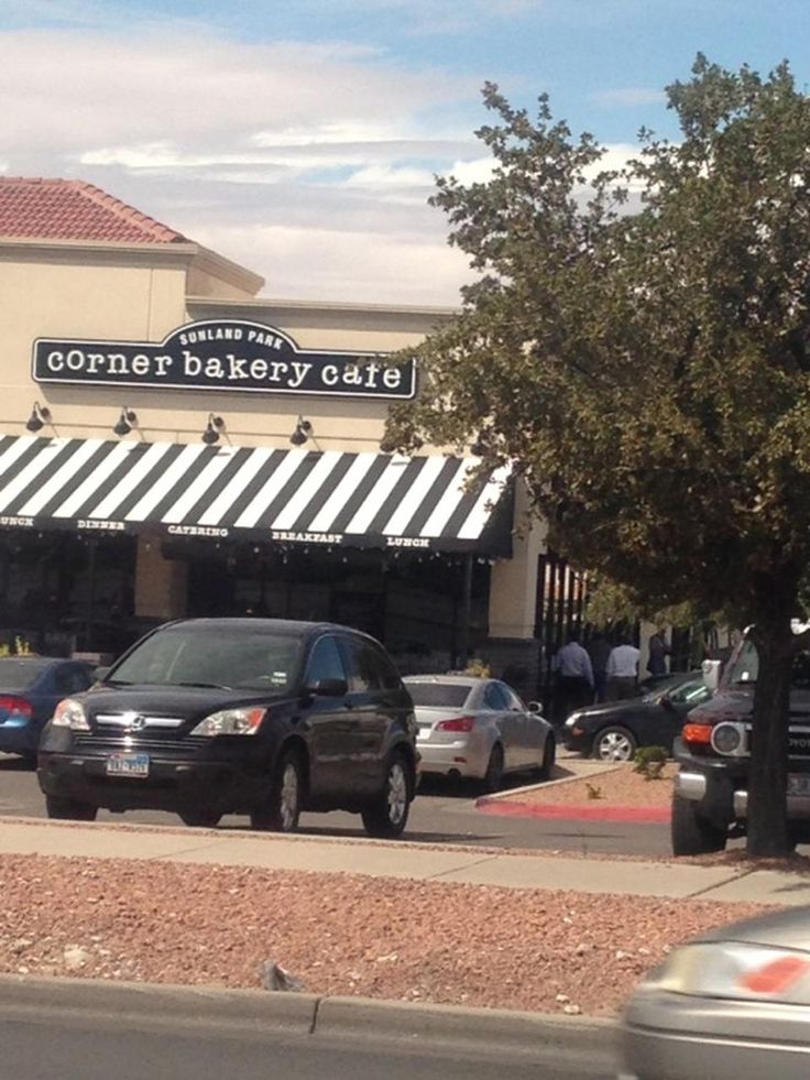 cars are parked in front of a bakery