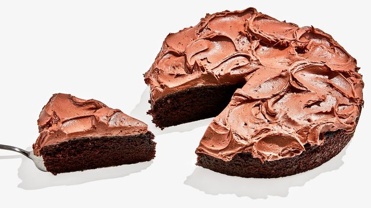 a chocolate cake with one slice cut out and the other half is missing from it