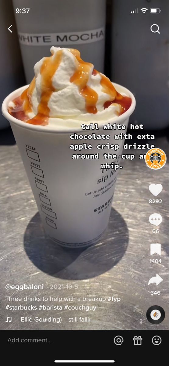 a cup of ice cream with caramel drizzle and whipped cream on top