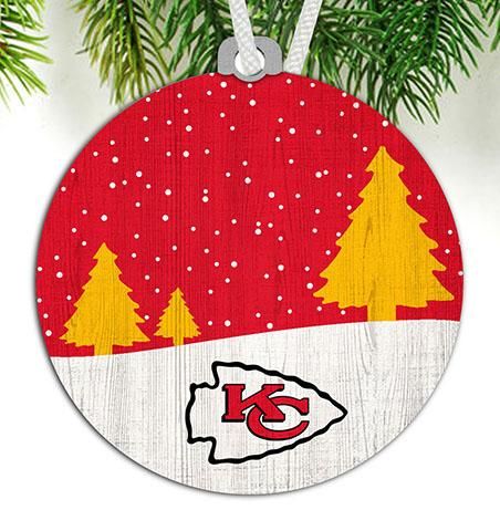 a wooden ornament hanging from a christmas tree with the kansas chiefs logo on it