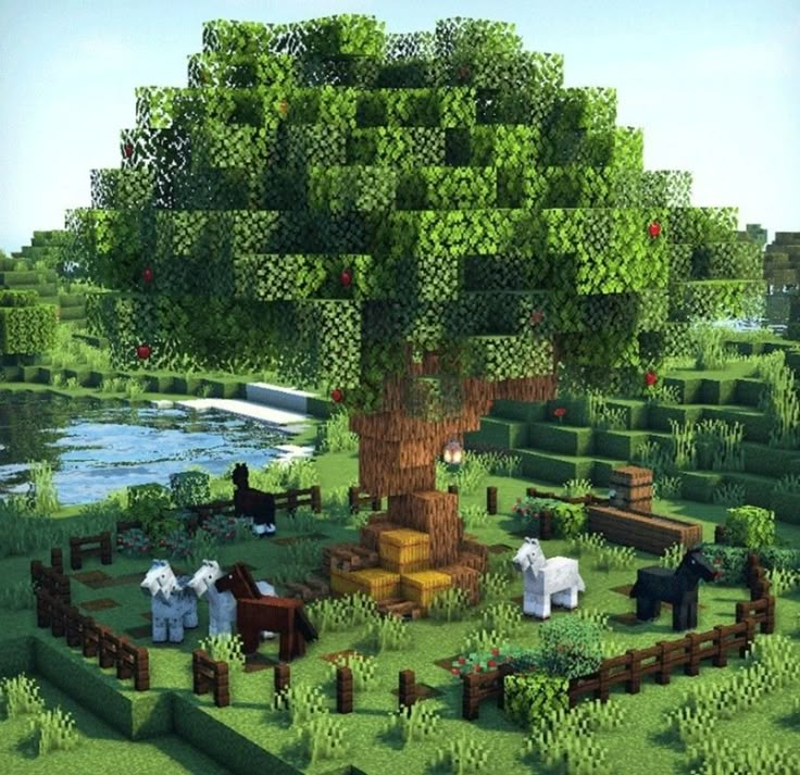 an image of a tree in the middle of a field with people sitting around it