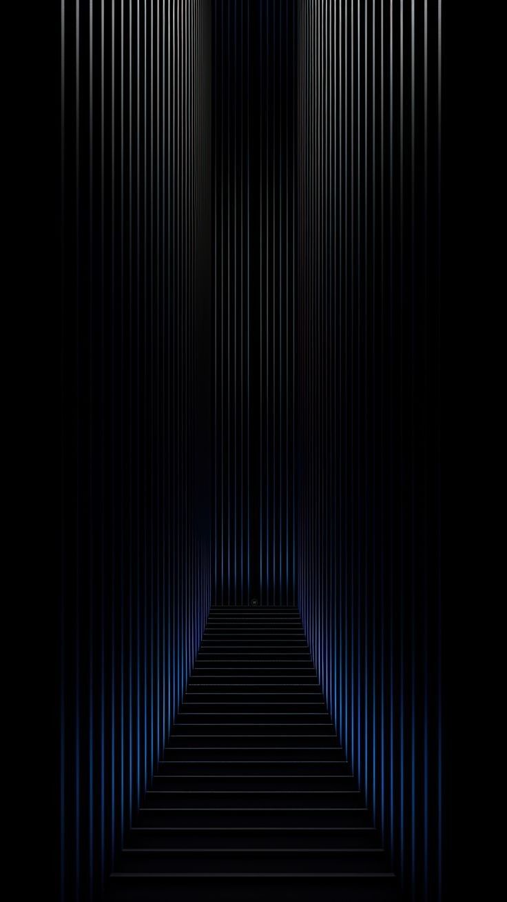 an image of a dark tunnel with light coming from the end and blue lines on the floor