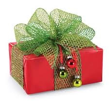 a red gift box with a green bow and bells