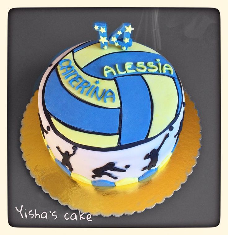 a birthday cake with a volleyball design on it's side and the name alesia written in blue