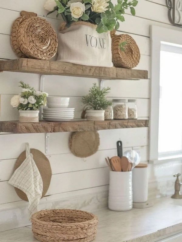 some shelves with baskets and flowers on them