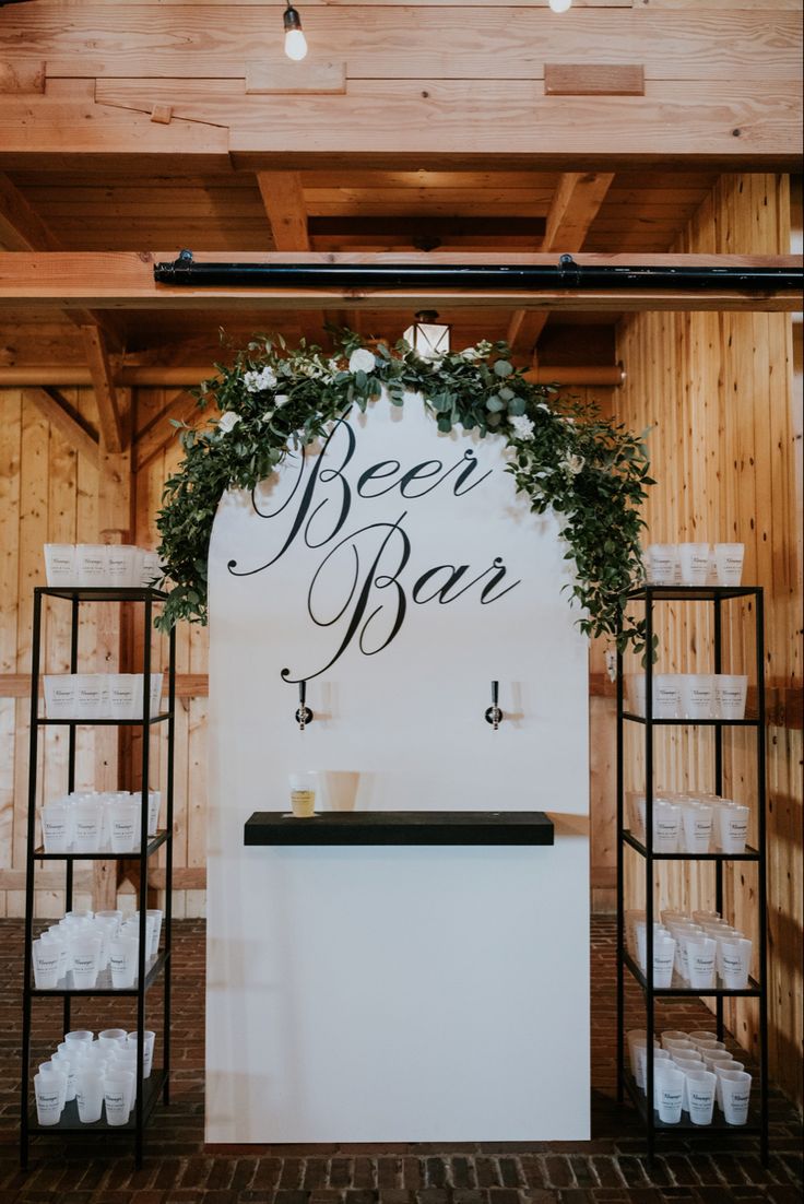 a sign that says beer bar on the wall