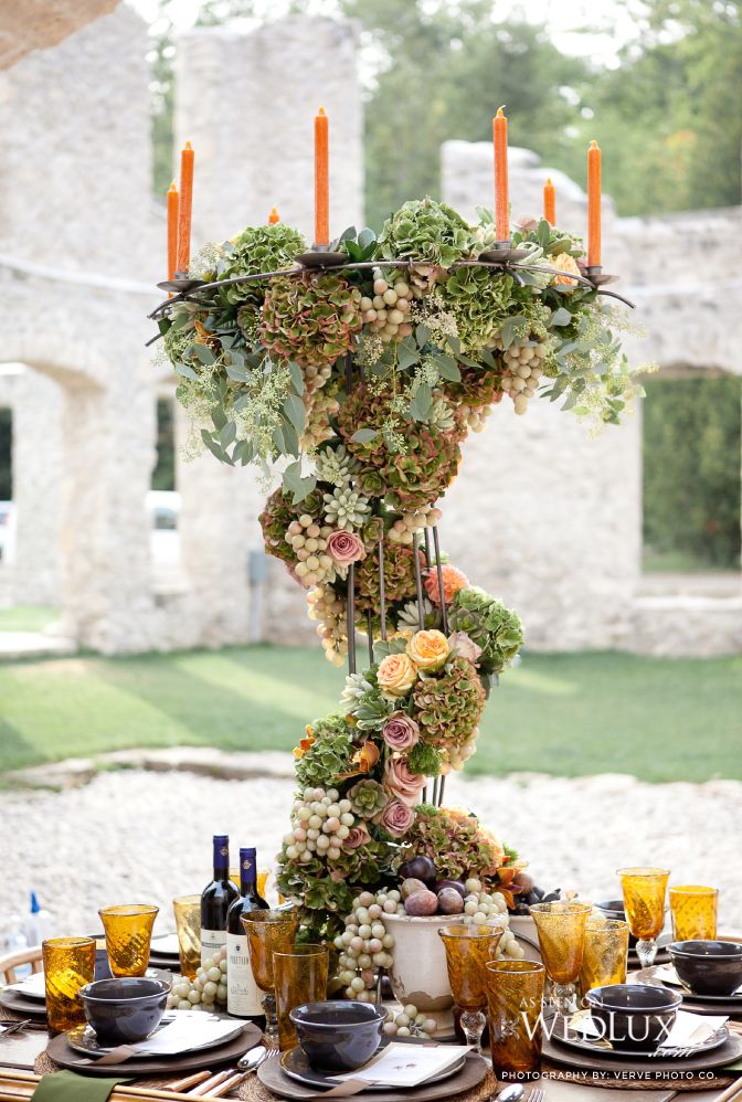 the table is set with candles and flowers