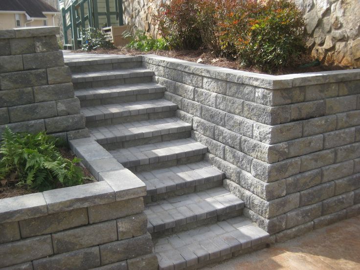 stone steps lead up to the side of a house