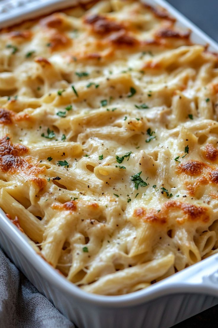 a casserole dish filled with pasta and cheese