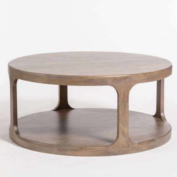 a round coffee table with two circular bases on each side and an open shelf underneath it