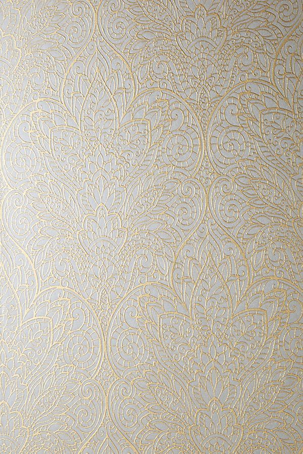 an ornate wallpaper pattern in gold and silver with metallic foil on the bottom half