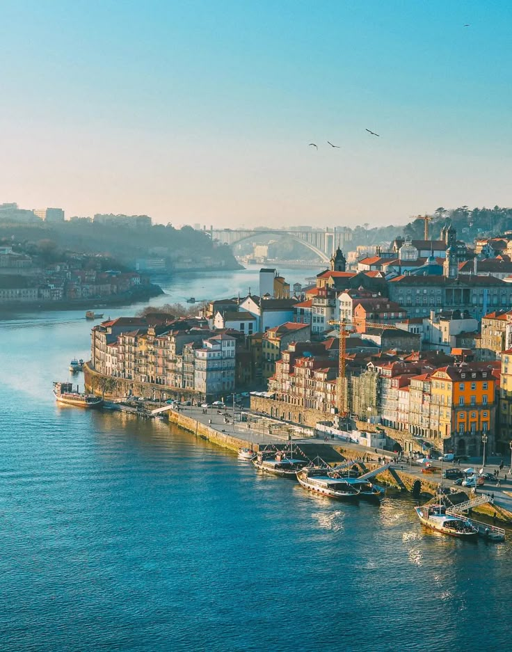 an aerial view of a city on the water