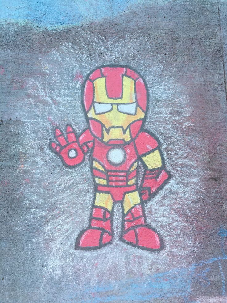 a drawing of iron man on the ground with chalk pastel and colored pencils