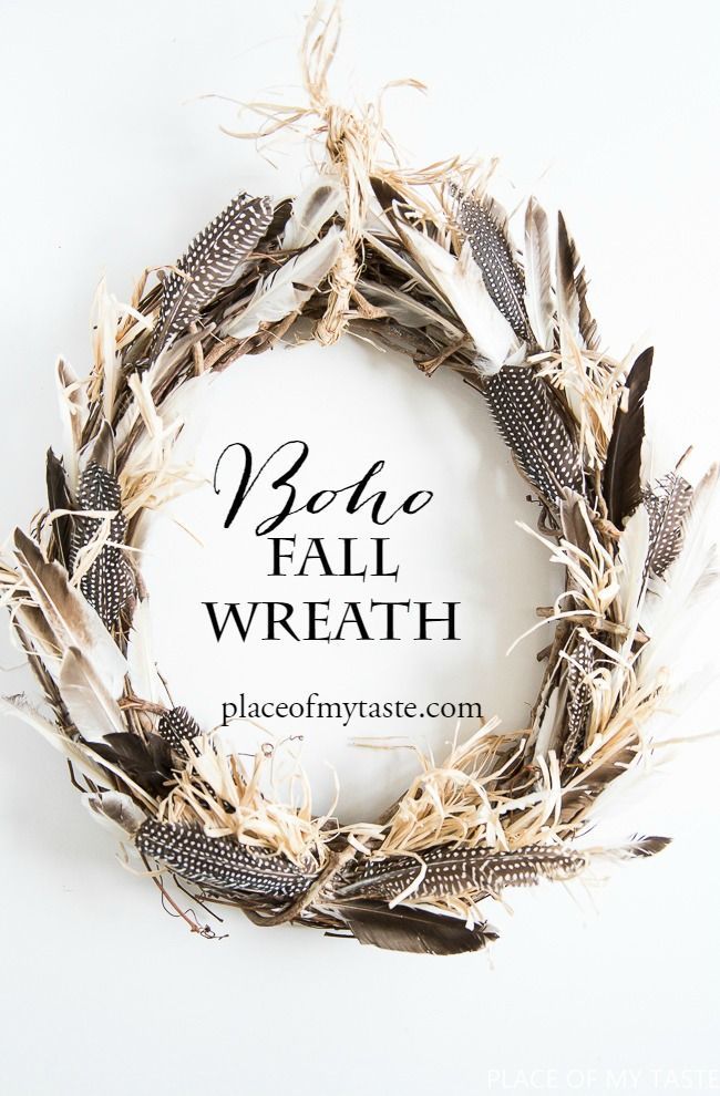 a wreath made out of dried feathers with the words base fall wreath written in black