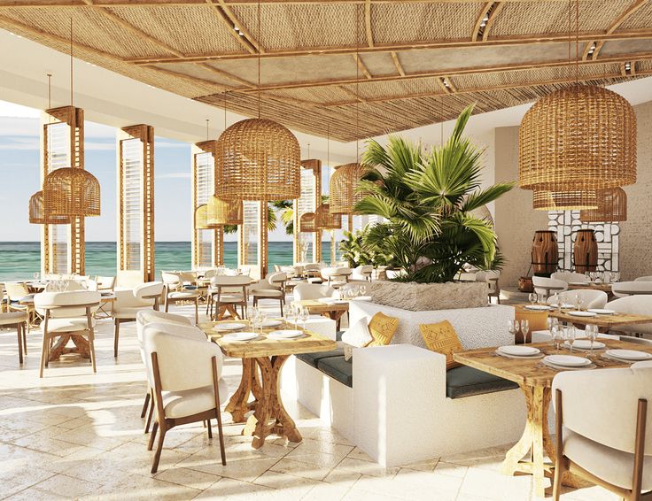 an outdoor dining area with tables, chairs and wicker hanging lamps on the ceiling