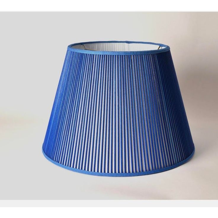 a blue lamp shade on a white background