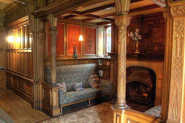 a living room filled with furniture and a fire place