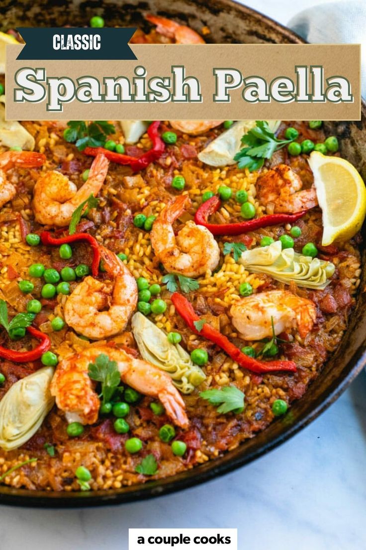 spanish paella with shrimp and peas in a skillet