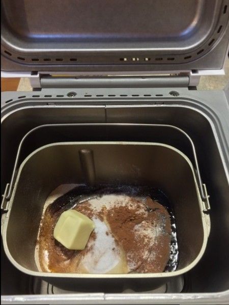 an oven with some food in it and one piece of butter on the stove top