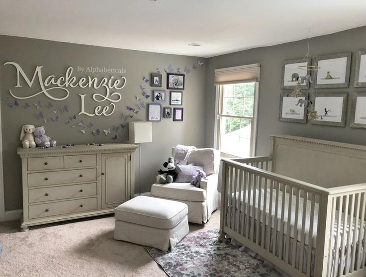 a baby's room decorated in gray and white