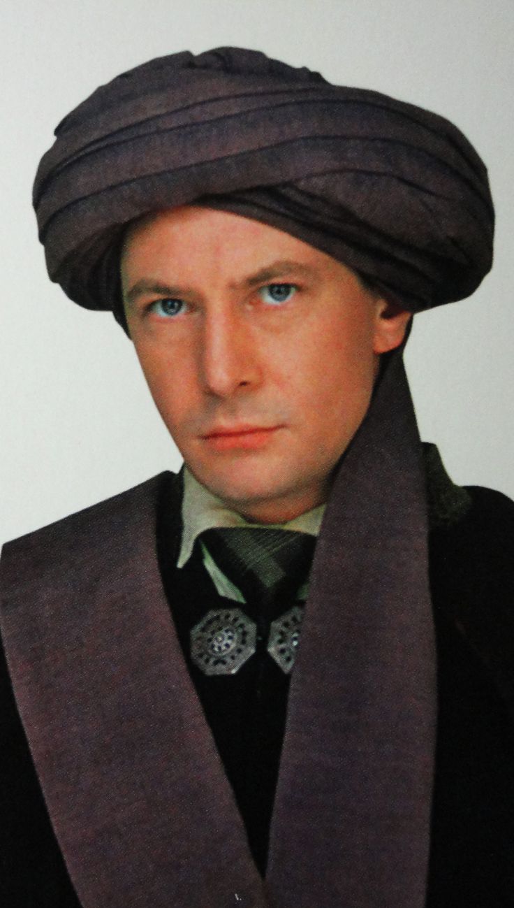 a man with a turban and tie on