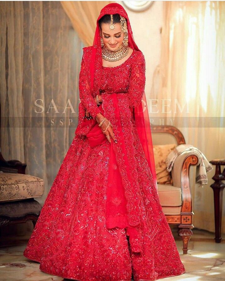 a woman in a red wedding dress