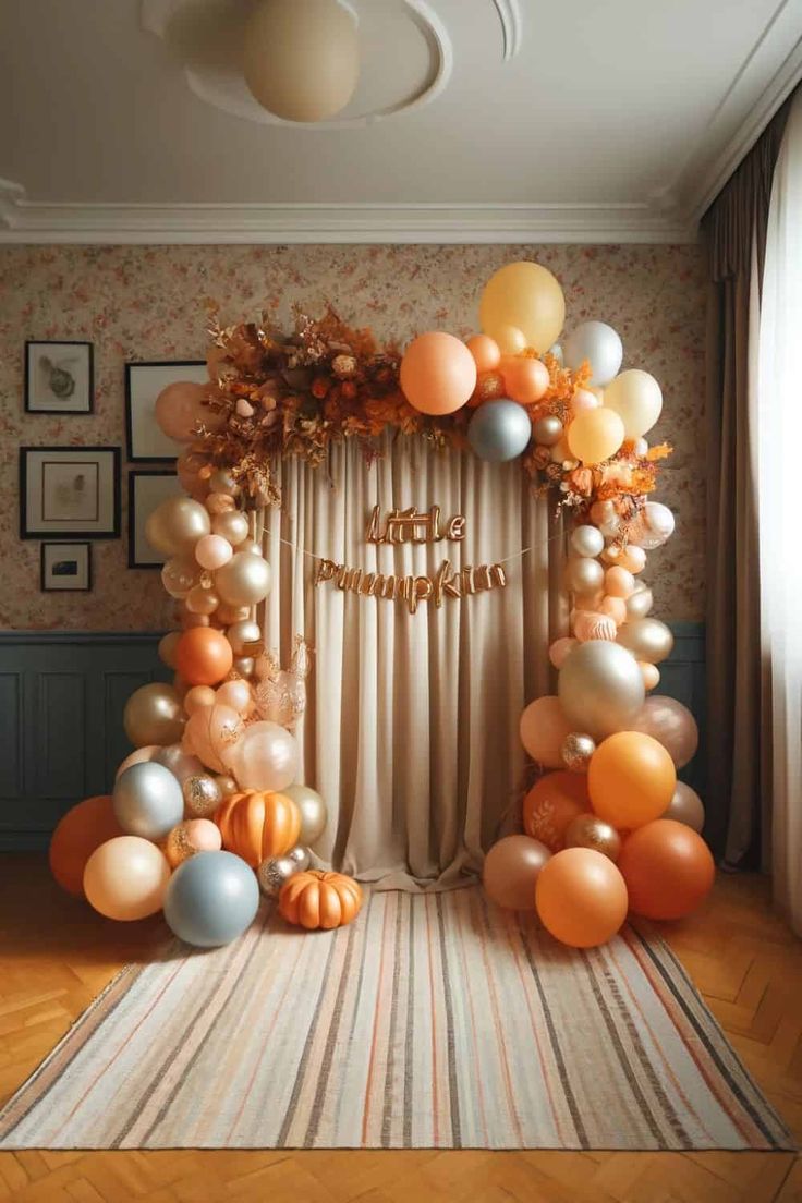 an arch made out of balloons with the words happy mother written on it in gold and silver