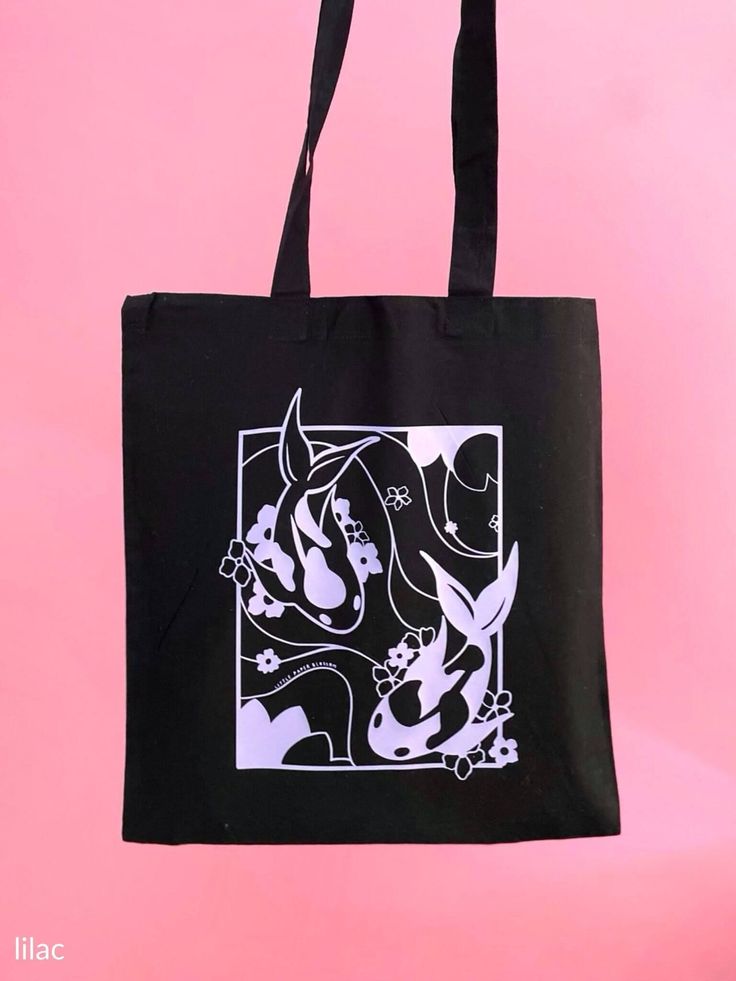 [CommissionsEarned] Koi Fish Are A Symbol Of Good Luck, Courage, And Perseverance In Southeast Asian Culture. A Perfect Token For You! Take This Gorgeous And Calming Koi Pond Design Everywhere You Go With Our Sturdy 100% Cotton Tote Bags. Information: Material: 100% Cotton Thickness: 150Gsm (Thick And Sturdy) Dimensions Of Bag: 23 23 Cm Dimensions Of Handles: 23 X 2.5Cm The Art Is Printed On Durable, High-Quality Vinyl. Colour Of Tote Bags: Black We Also Offer #cooltotebagdesign Black Canvas Bag Painting Ideas, Tote Design Ideas, Black Tote Bag Painting Ideas, Creative Tote Bag Design Ideas, Black Tote Bag Design Ideas, Black Tote Bag Design, Black Tote Bag Aesthetic, Design For Tote Bag, Cool Tote Bag Design