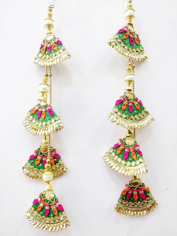 two pairs of earrings with colorful beads hanging from them