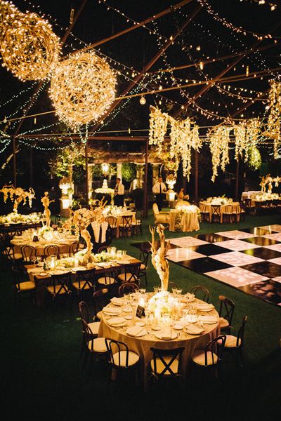 an instagram page with tables and chairs covered in lights