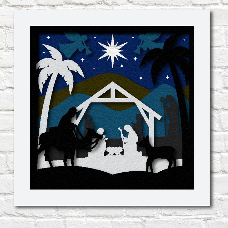 a paper cut nativity scene with the birth of jesus