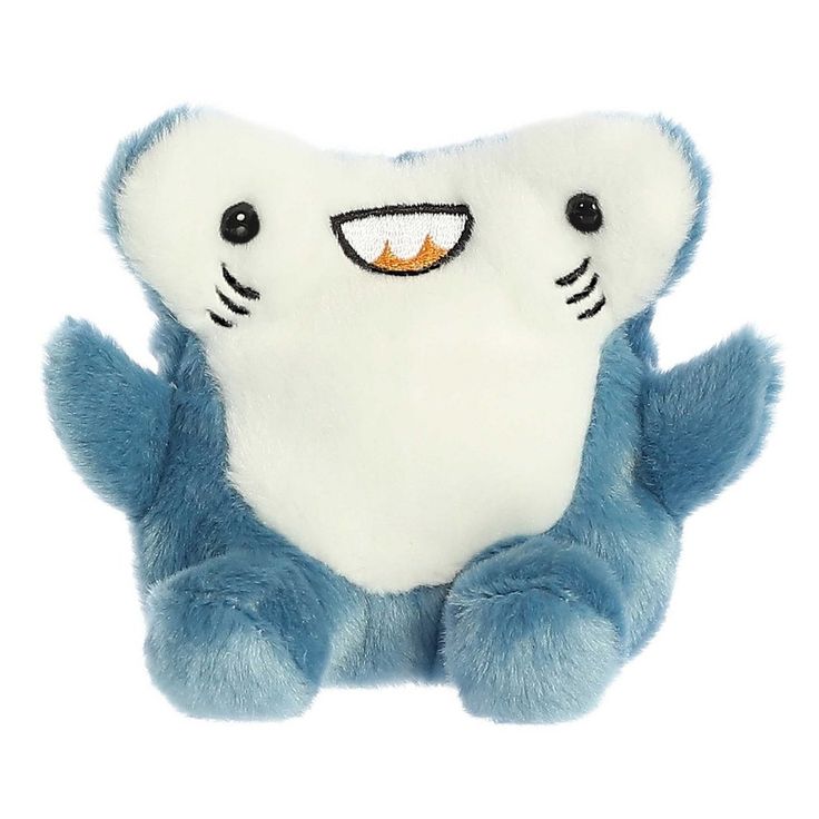 a blue and white stuffed animal with teeth