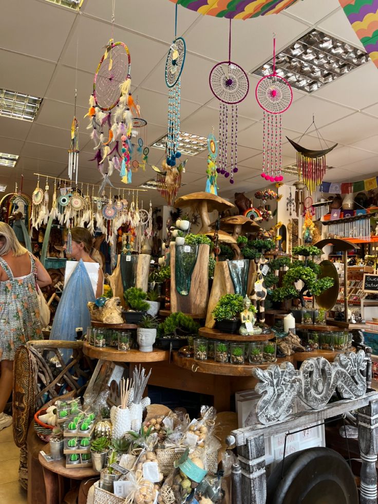 a store filled with lots of different types of items and decorations hanging from the ceiling