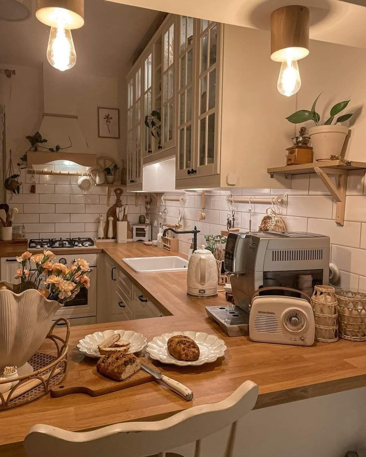 a kitchen filled with lots of counter top space and wooden counters topped with plates of food