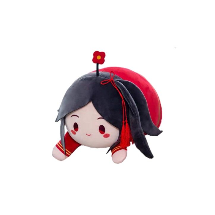 a small stuffed animal with a red flower on it's head and black hair