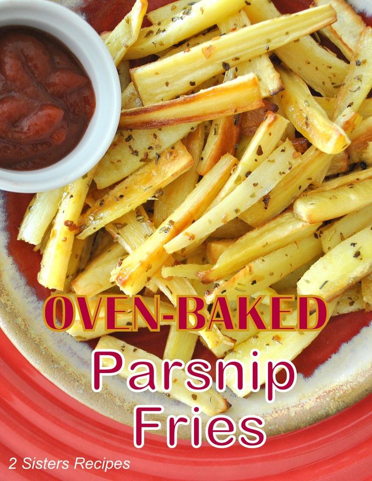 oven baked parsnip fries on a red plate with sauce in the middle