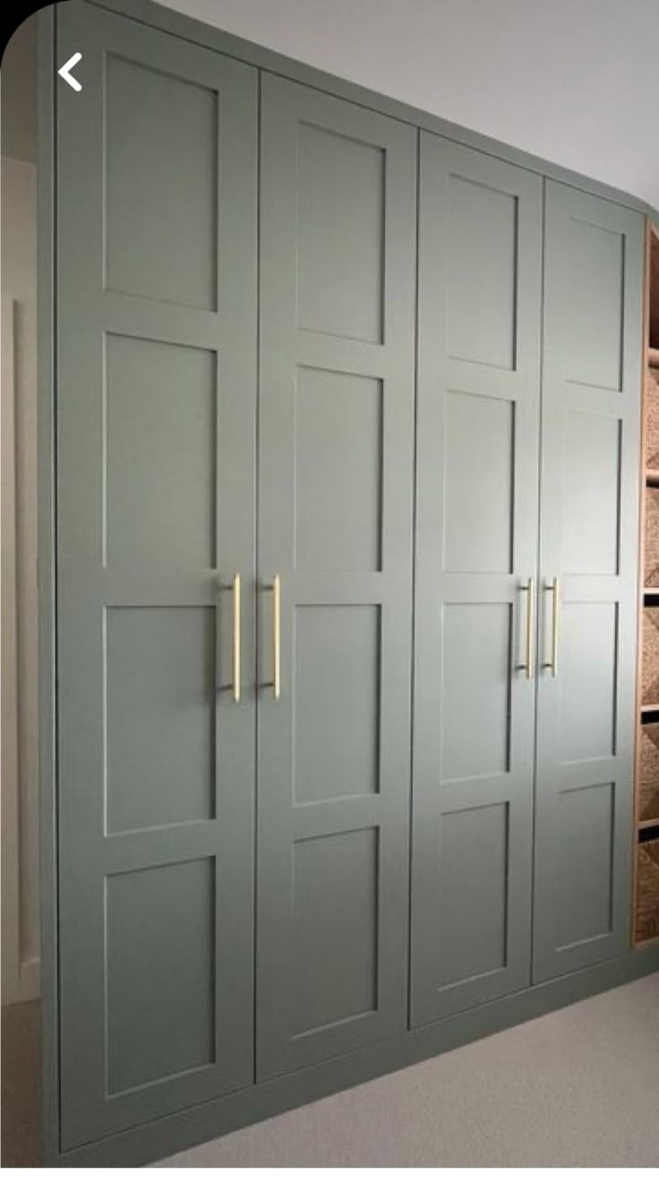 an empty room with several cabinets and drawers