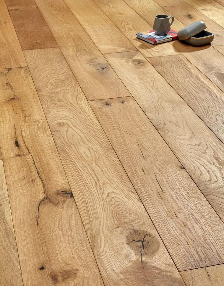 a wooden floor that has been cleaned and is laying on the ground next to a hair dryer