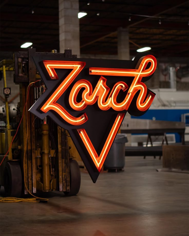 a large neon sign that says zorch on it's side in an industrial building