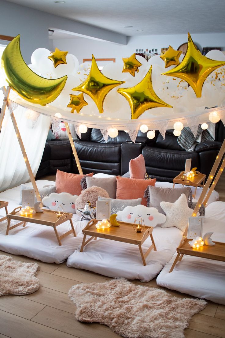 a living room filled with lots of furniture and decorations on top of it's wooden floors