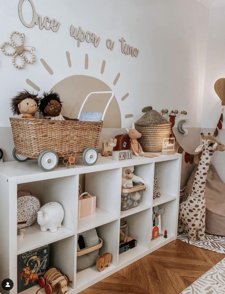 a child's room with toys and stuffed animals on the shelves in front of it