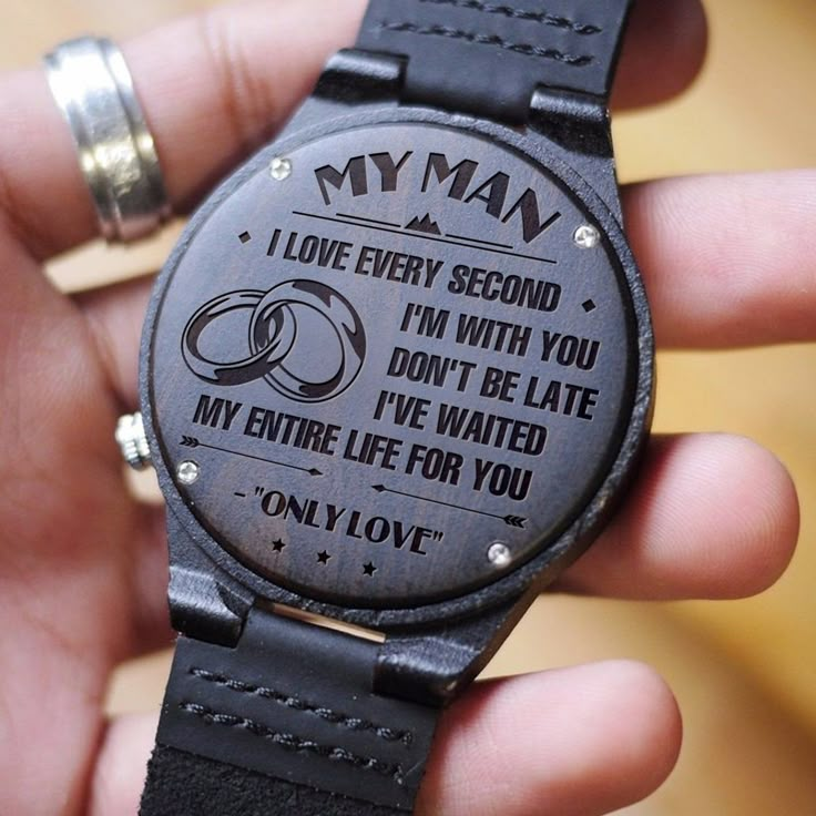 a person holding a wooden watch with the words, i love every second don't be late my entire life for you on it